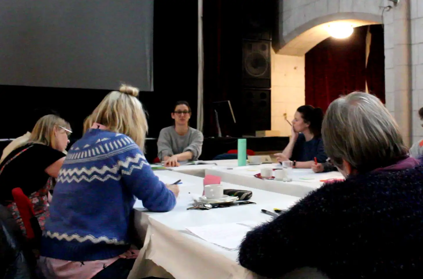 Participants talking around a workshop table