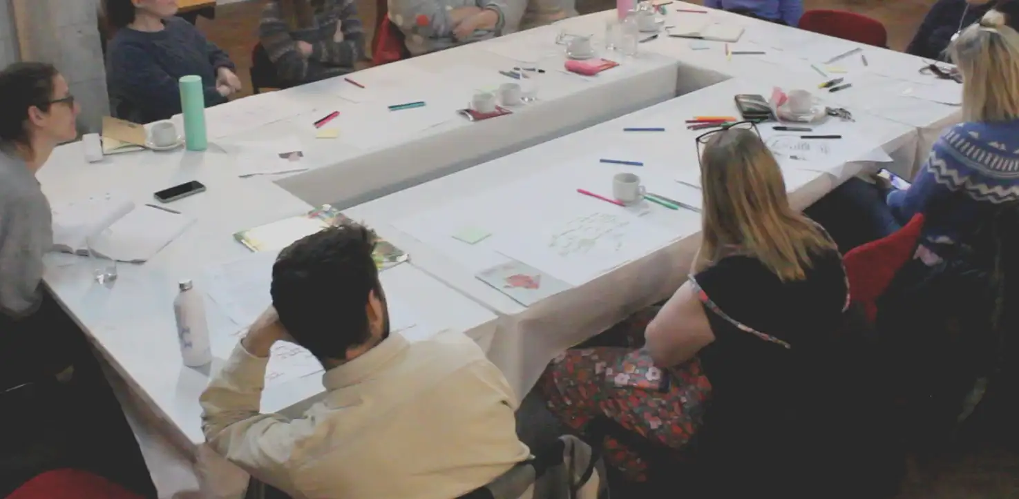 Participants around a table at a Coastal Community Leaders workshop