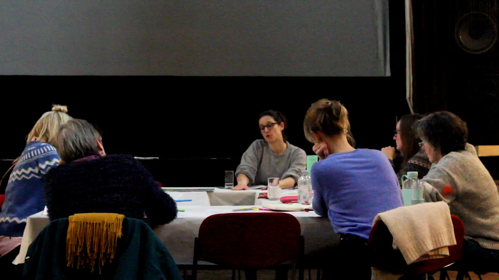 Participants talking around a table at a Coastal Community Leaders workshop