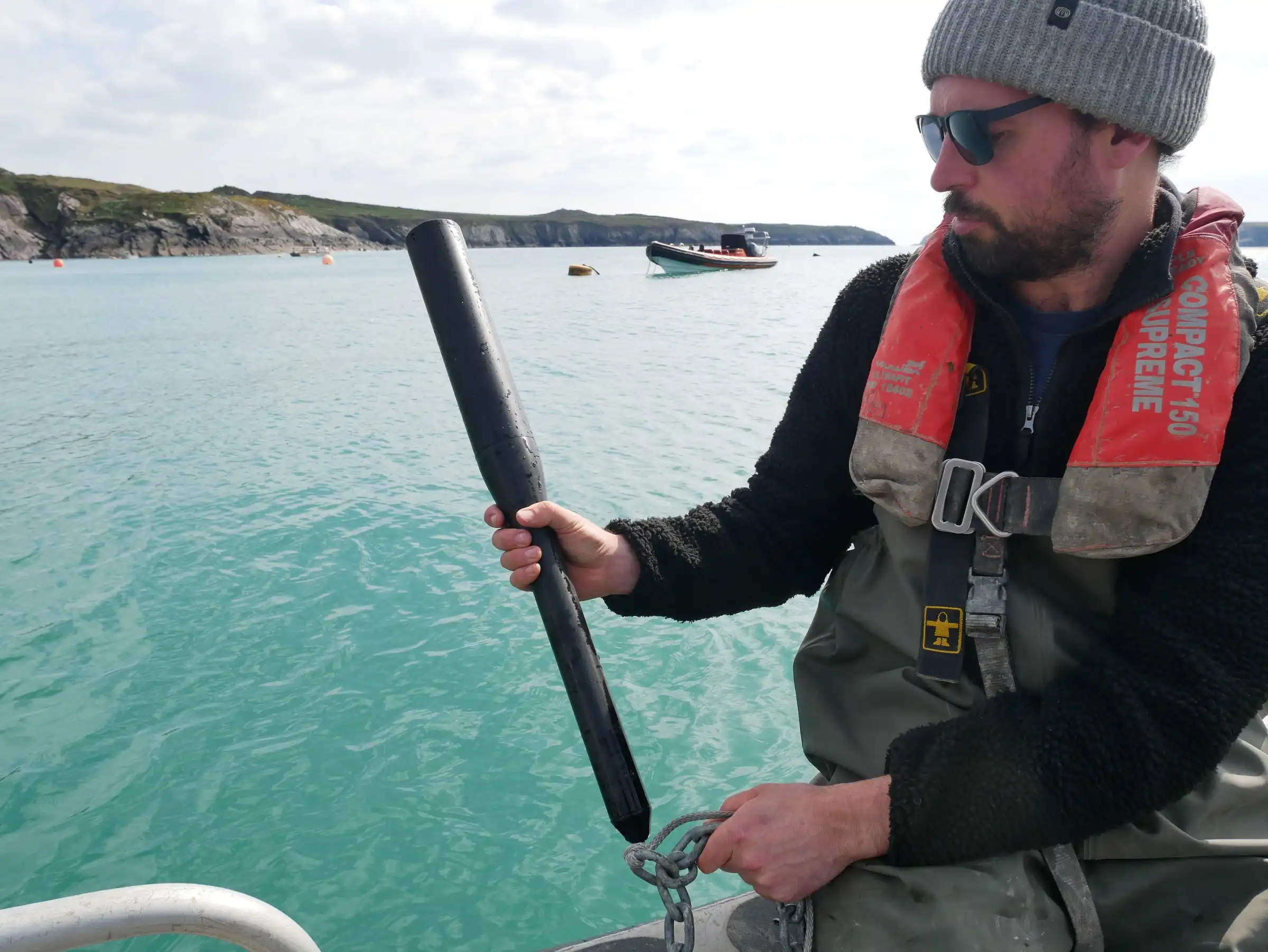 A GrowProbe 4 held upright on a boat, ready to deploy