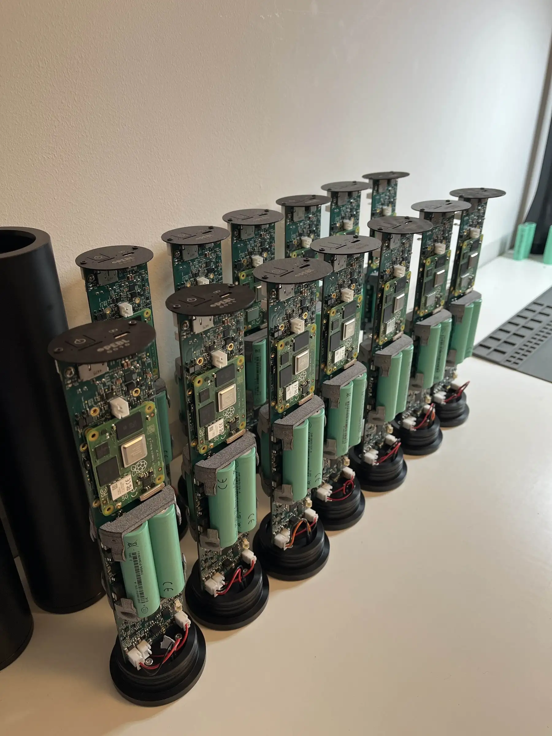 Row of completed PEBL GrowProbe sensor units ready for shipping