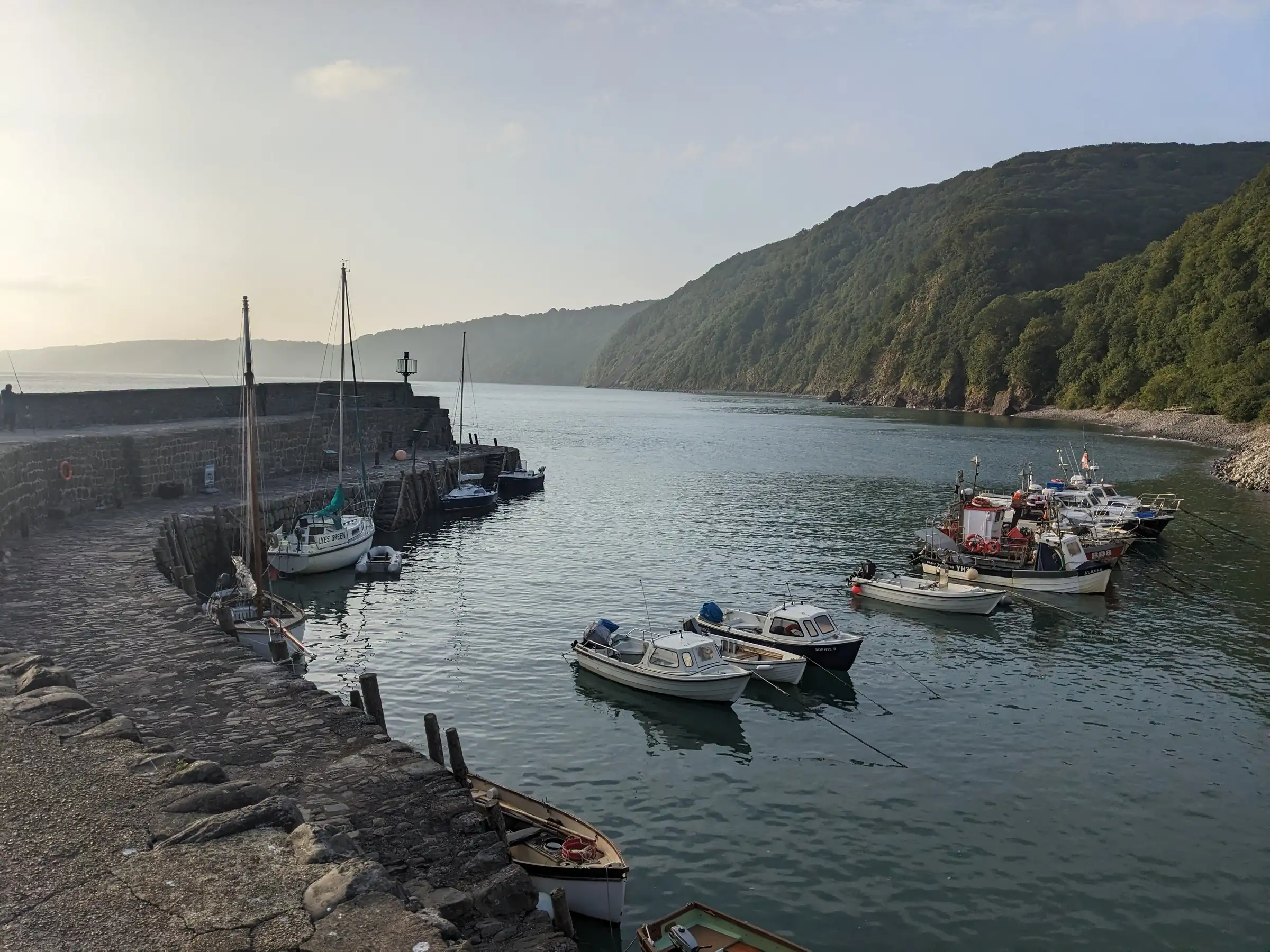 Small boats moored in a sheltered coastal bay