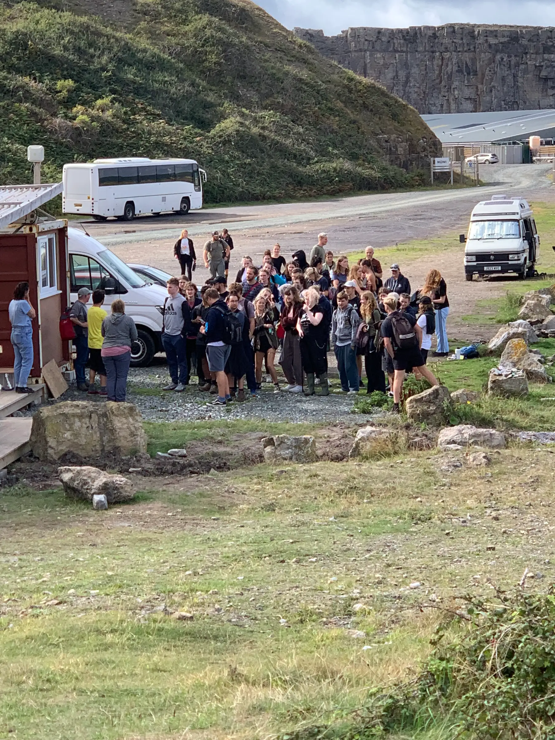 The workshop group gathered beside the coast road