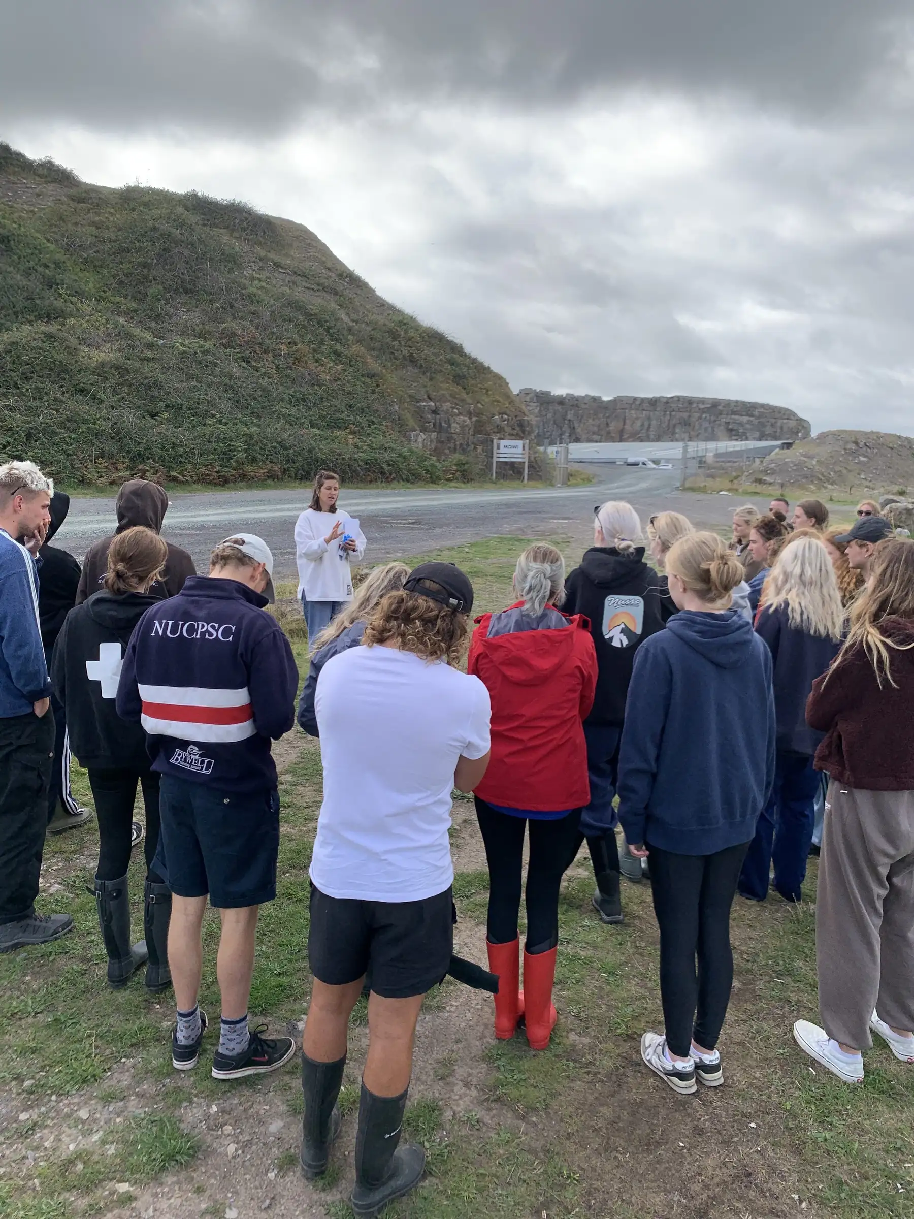 Students standing on a coastal path during the workshop