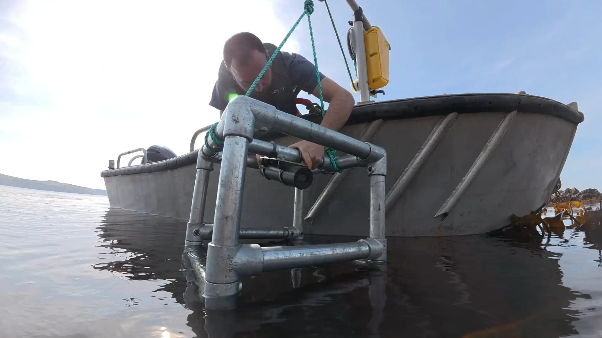 SubCam monitoring frame on a small boat at the water surface
