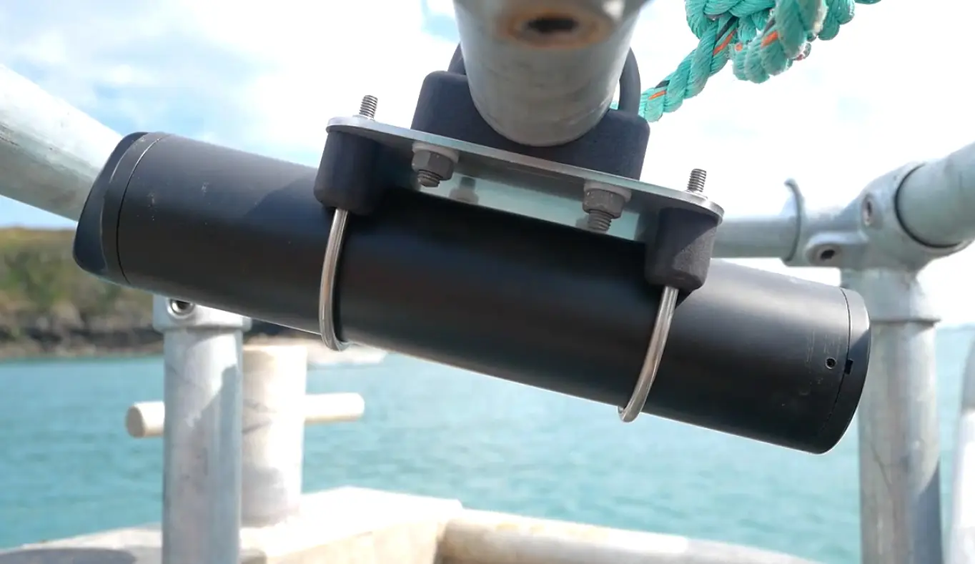 A SubCam clamped to a galvanised rail with the mounting kit plate, brackets and stainless u-bolts