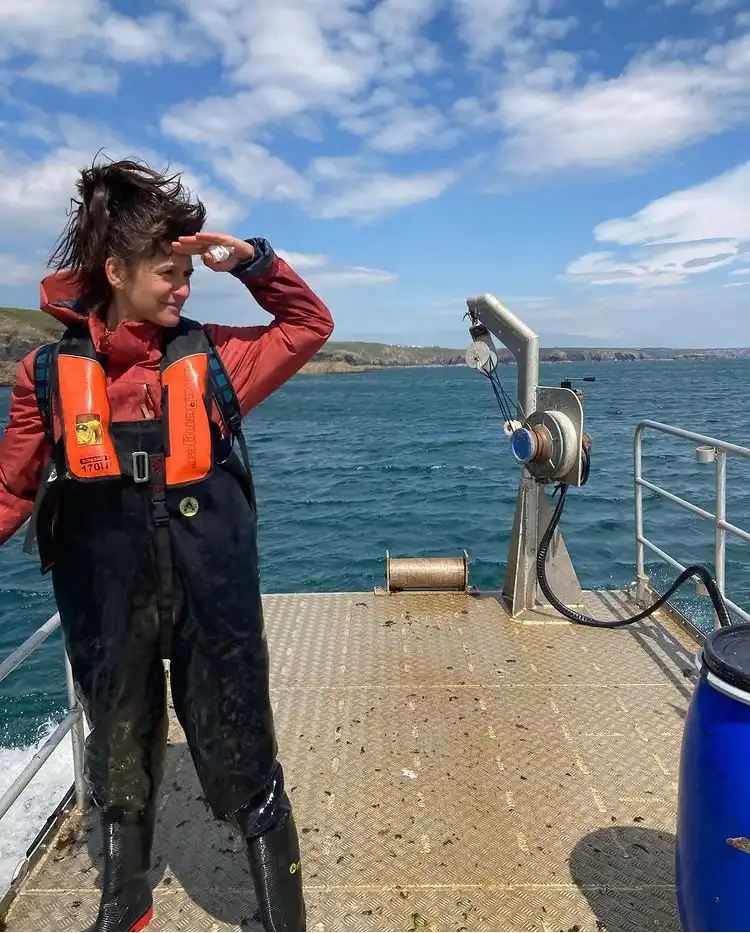 Dani Abulhawa on the deck of a boat at sea